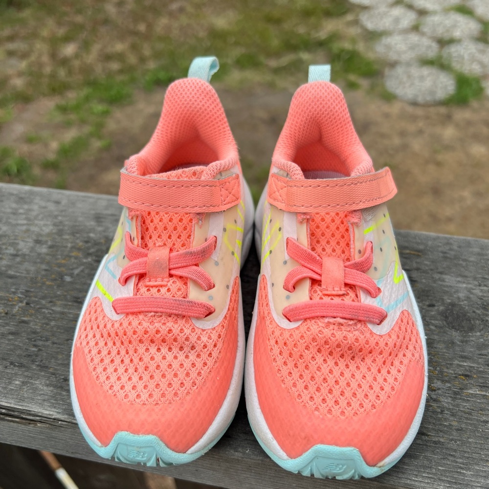 Coral colored New Balance Kids Shoes with Velcro Strap